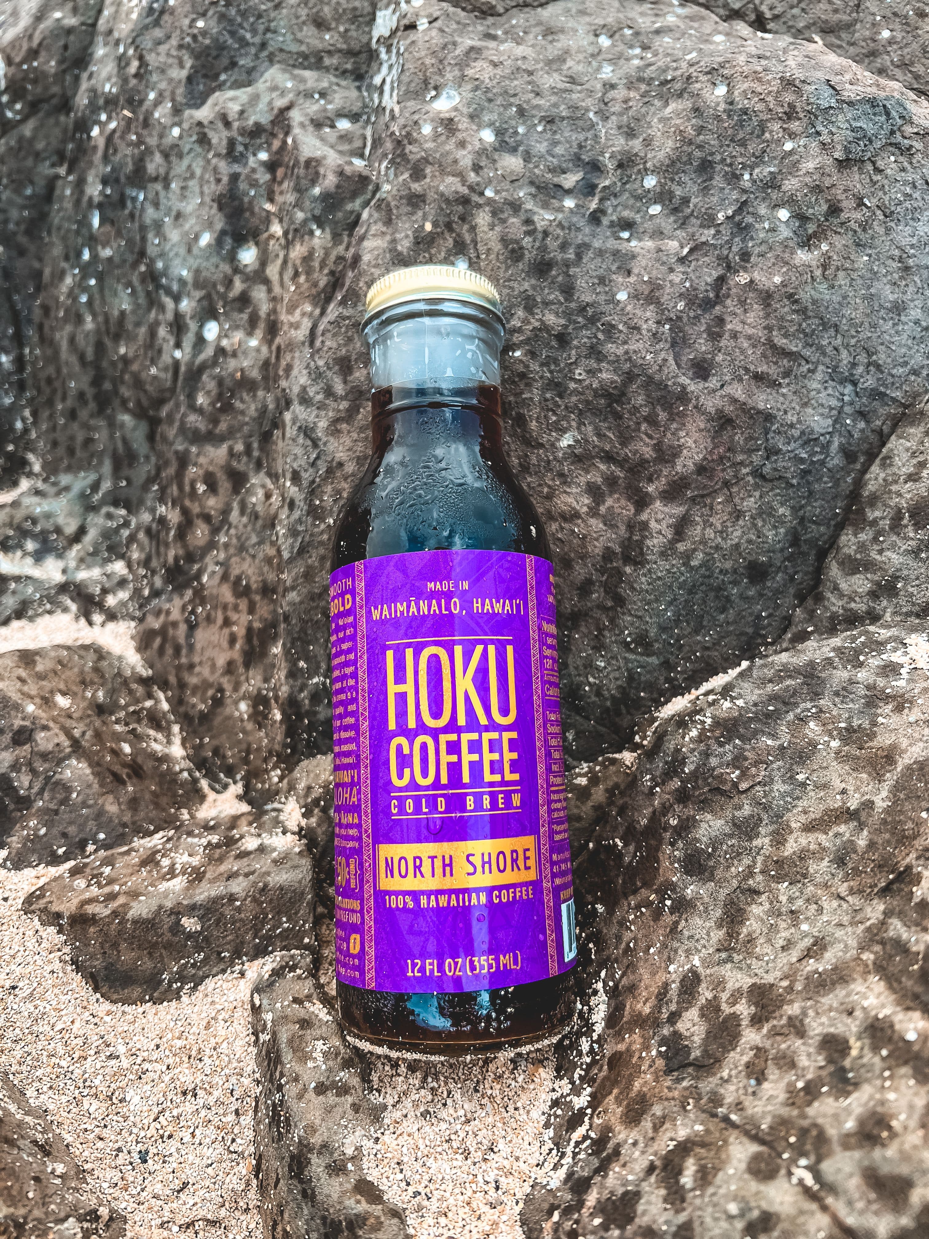 Hoku North Shore cold brew bottle on lava rocks
